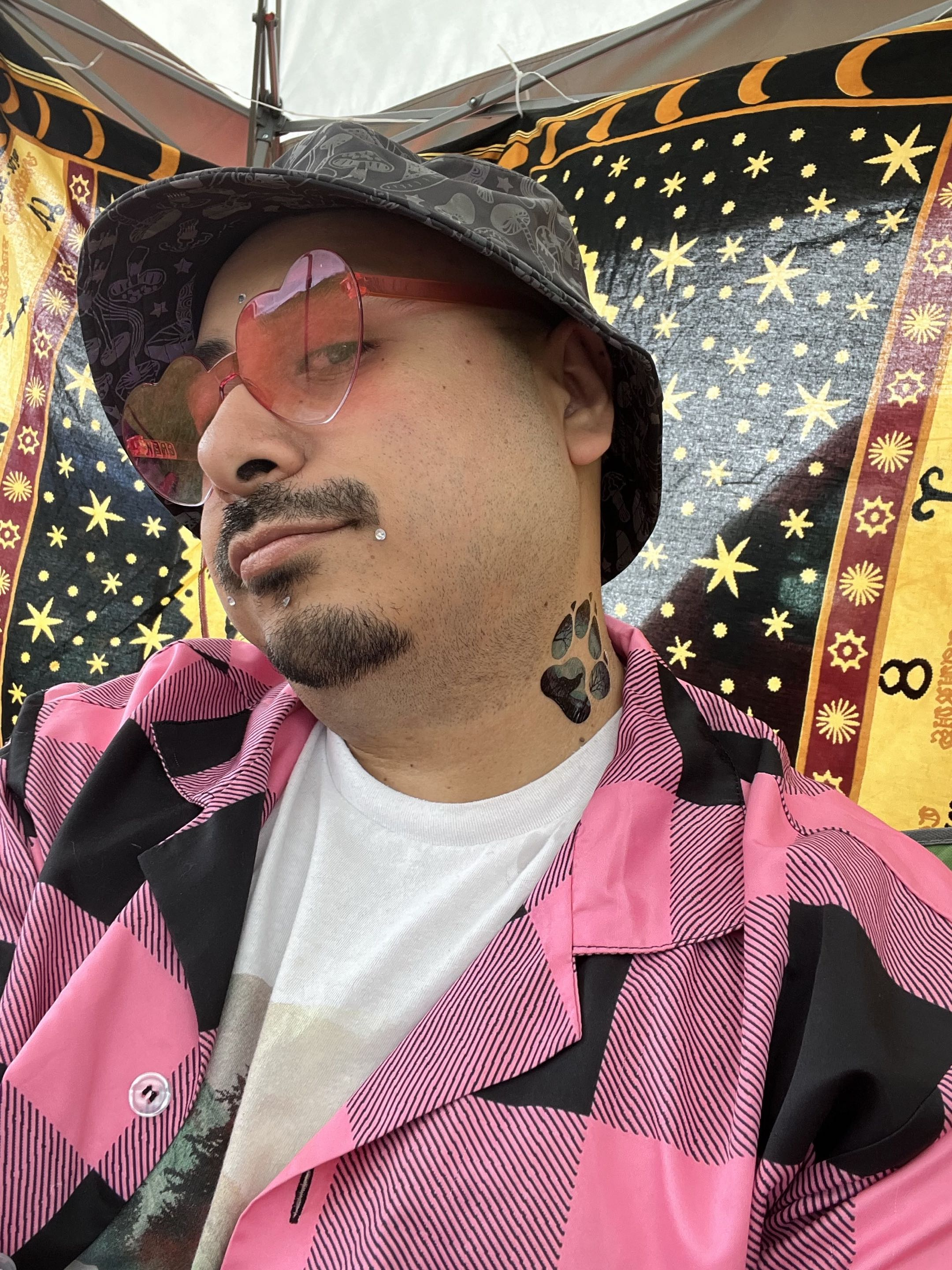 Jacob L. in pink glasses and a patterned hat