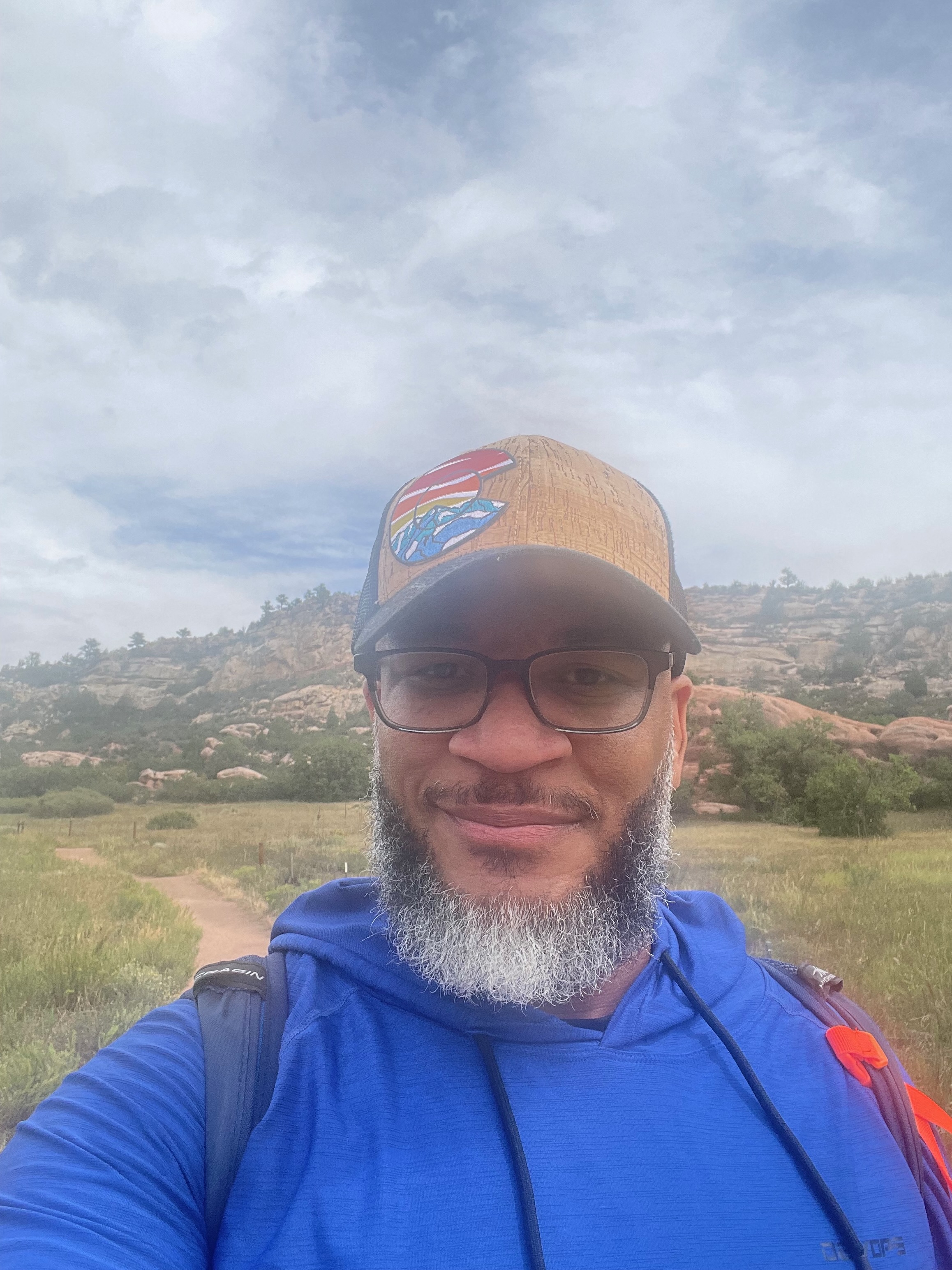 Reginald “Reggie” Halstead hiking near red-rock formations